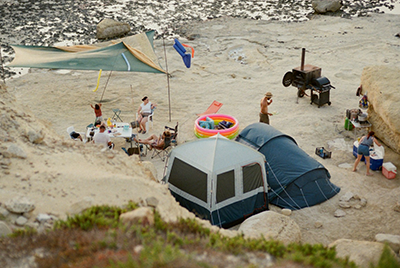 Campers enjoying rented shelters on a coastal trip